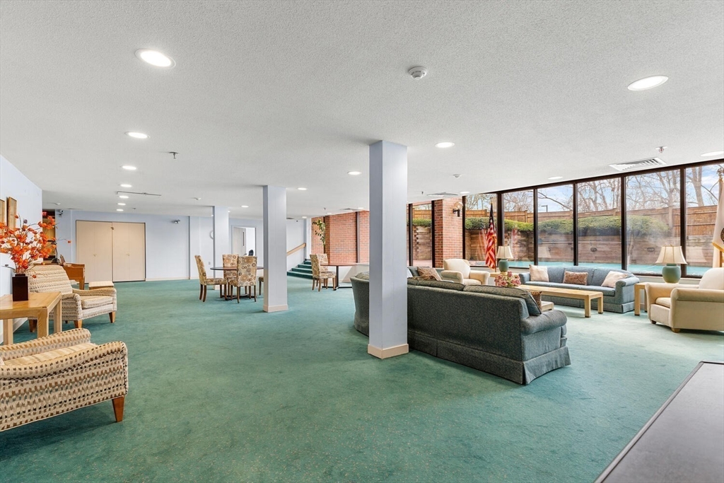 100 Rosemary Way, Unit 325 Needham, MA 02494 - Photo 20 of 24 a living room with furniture and a large window