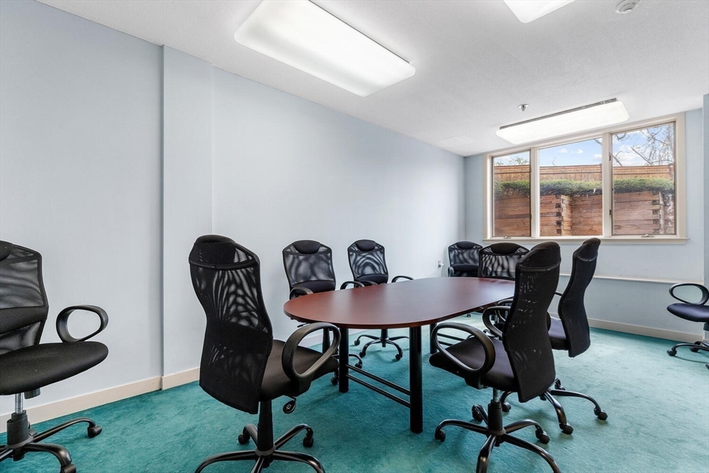 100 Rosemary Way, Unit 325 Needham, MA 02494 - Photo 21 of 24 a view of a workspace room with furniture and a window