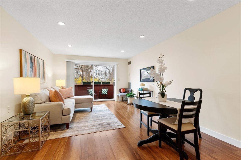 100 Rosemary Way, Unit 325 Needham, MA 02494 - Photo 5 of 24 a living room with furniture and a wooden floor