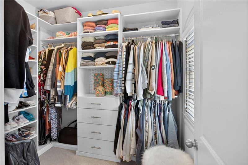 1956 Skyfall Circle Atlanta, GA 30319 - Photo 17 of 49 a view of walk in closet with clothes and shoes