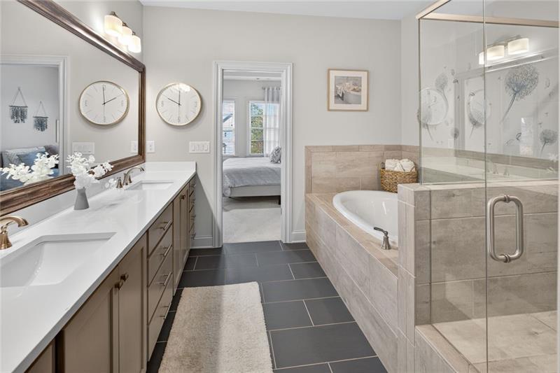 1956 Skyfall Circle Atlanta, GA 30319 - Photo 21 of 49 a bathroom with a tub sink and mirror