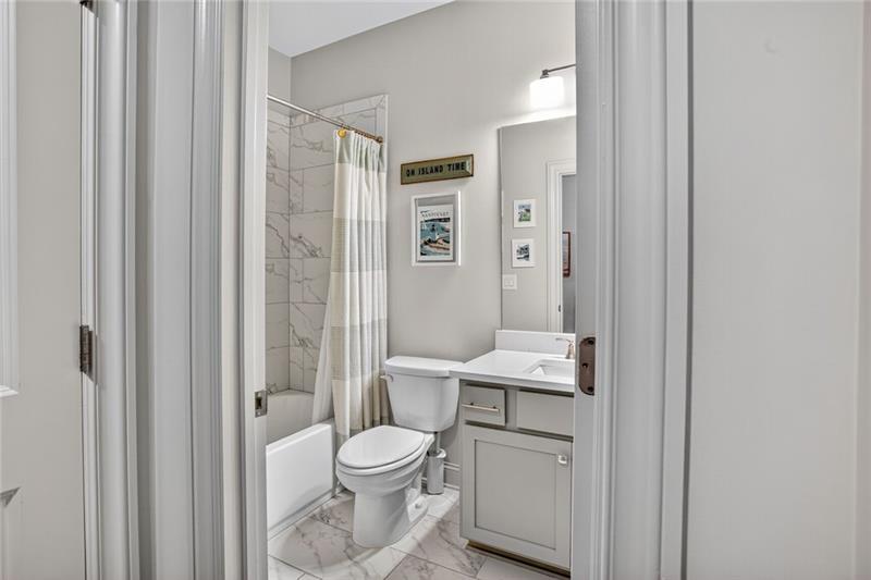 1956 Skyfall Circle Atlanta, GA 30319 - Photo 25 of 49 a bathroom with a toilet a sink and a mirror