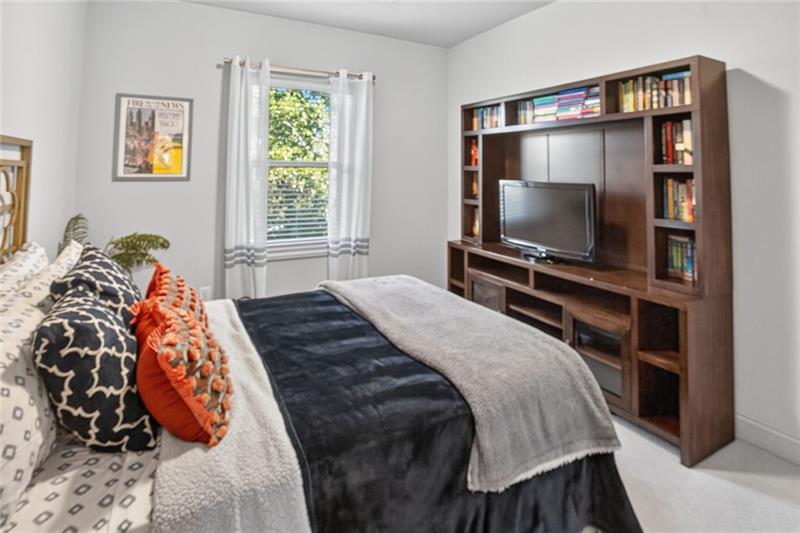 1956 Skyfall Circle Atlanta, GA 30319 - Photo 27 of 49 a bedroom with a bed and a flat screen tv