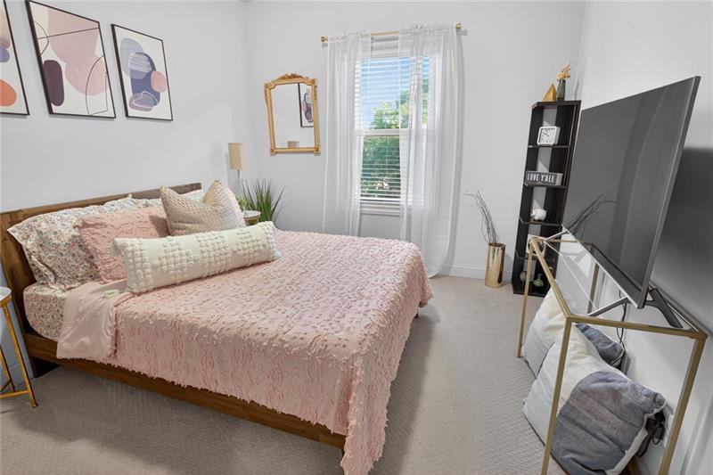 1956 Skyfall Circle Atlanta, GA 30319 - Photo 28 of 49 a bedroom with a bed window and a flat screen tv