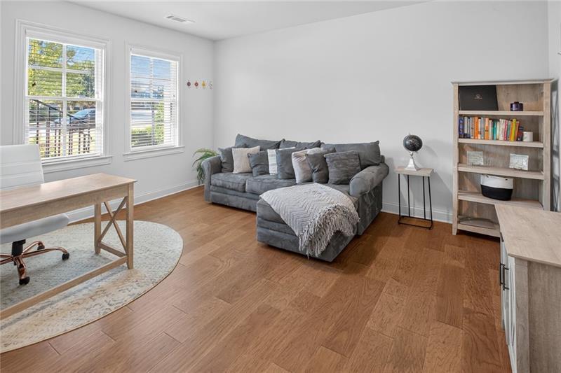 1956 Skyfall Circle Atlanta, GA 30319 - Photo 29 of 49 a living room with furniture and a large window