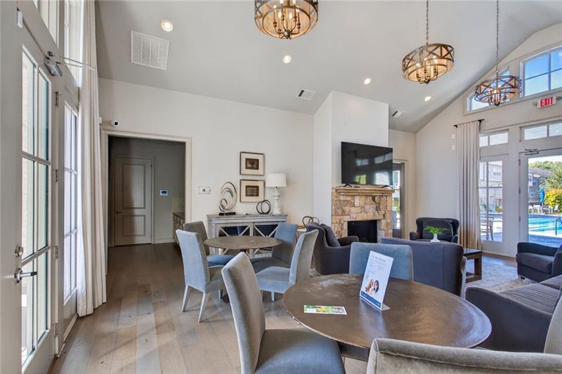 1956 Skyfall Circle Atlanta, GA 30319 - Photo 41 of 49 a living room with fireplace furniture and a chandelier