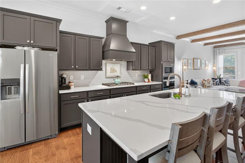 1956 Skyfall Circle Atlanta, GA 30319 - Photo 7 of 49 a kitchen with a table chairs refrigerator and cabinets