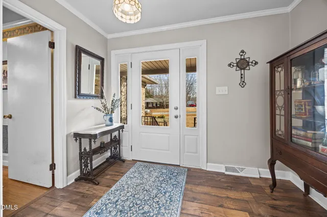 a living room with furniture flat screen tv and a fireplace