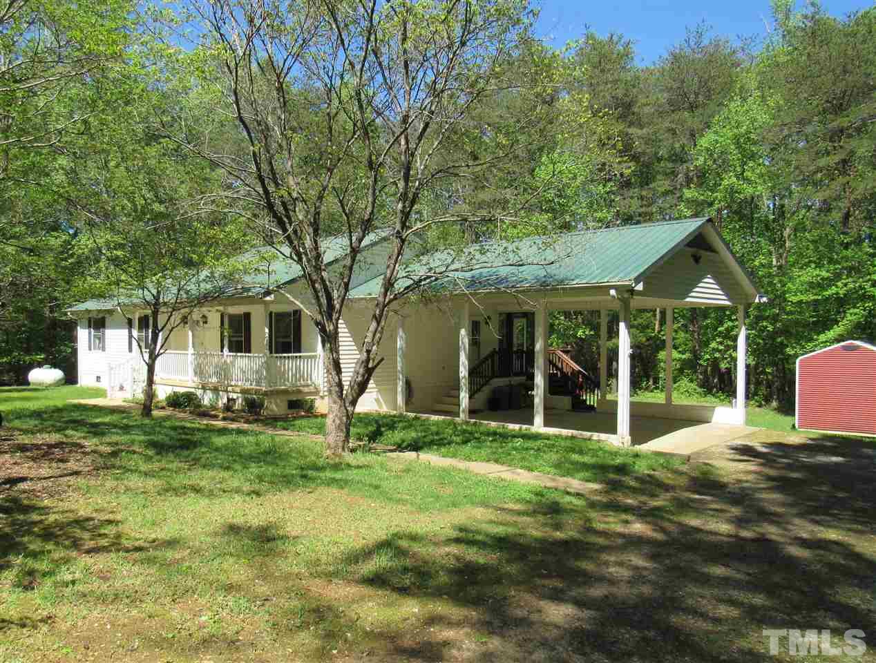 7204 Jock Road Bahama, NC 27503 - Photo 1 of 25 a front view of a house with a yard