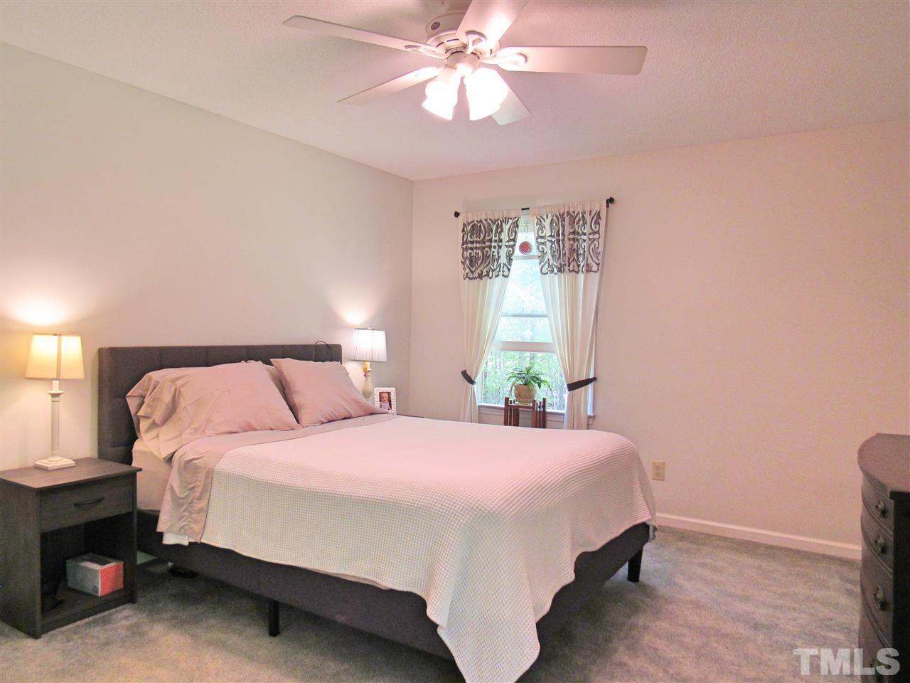 7204 Jock Road Bahama, NC 27503 - Photo 16 of 25 a bedroom with a bed and window