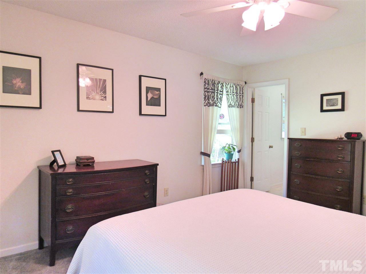 7204 Jock Road Bahama, NC 27503 - Photo 18 of 25 a bedroom with a bed and a dresser