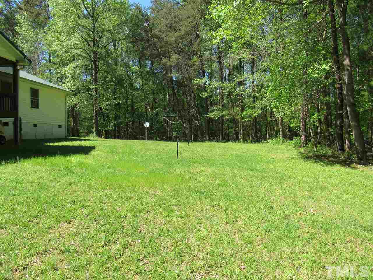 7204 Jock Road Bahama, NC 27503 - Photo 21 of 25 a view of green field with trees in the background