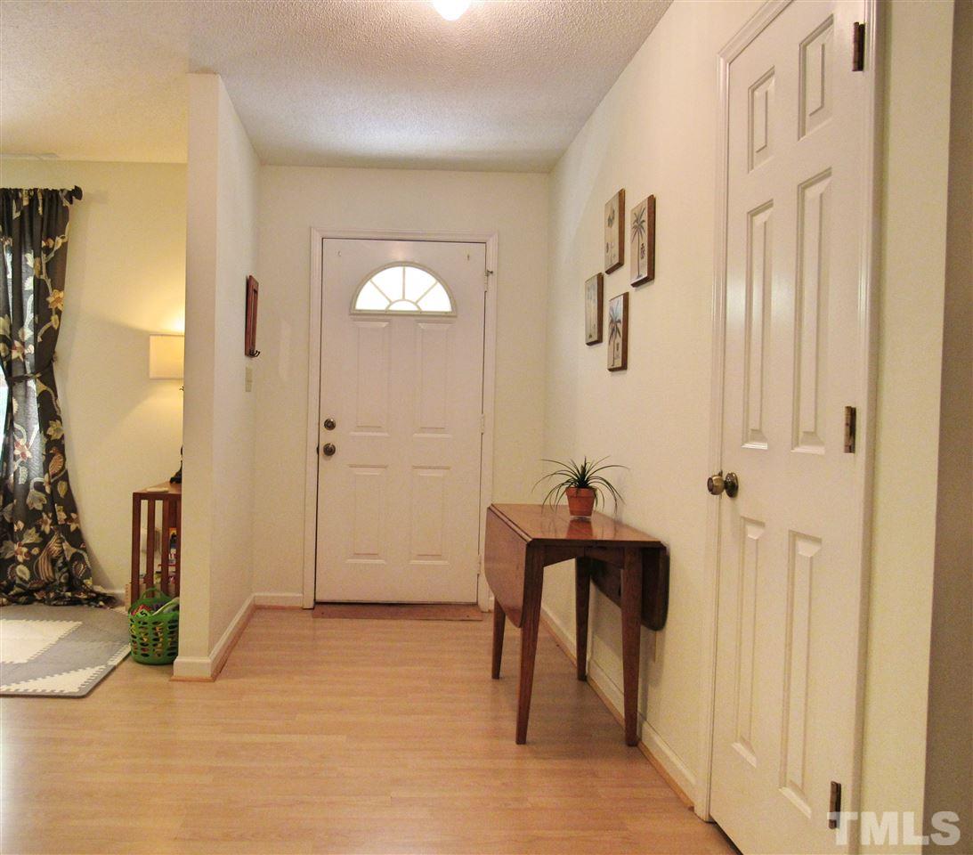 7204 Jock Road Bahama, NC 27503 - Photo 4 of 25 a view of a room that has a bed and a table in it