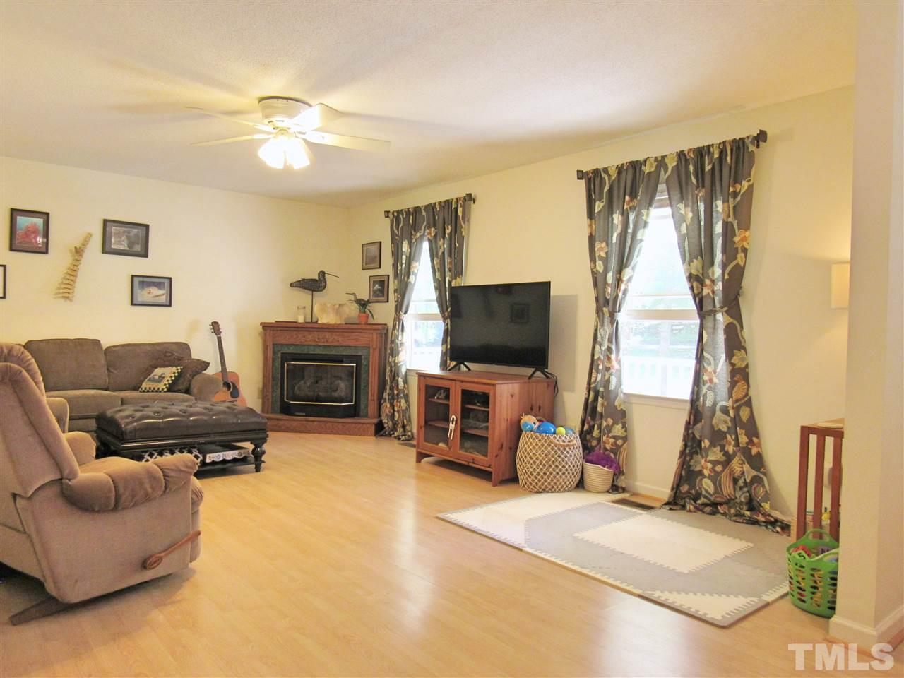 7204 Jock Road Bahama, NC 27503 - Photo 5 of 25 a living room with furniture and a flat screen tv