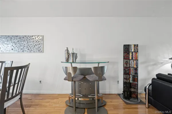 a view of a dining room with furniture and a chandelier