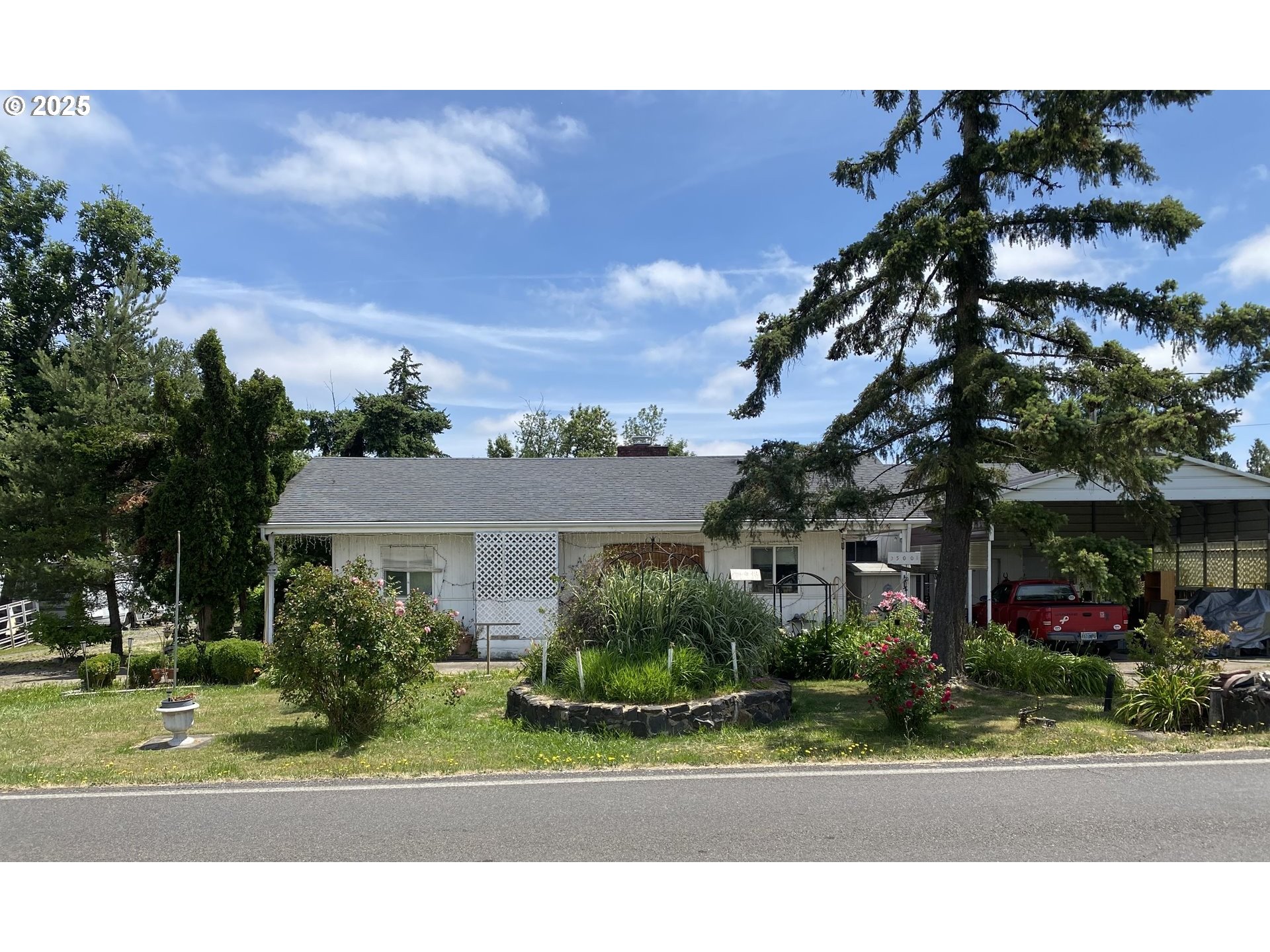 35001 Seavey Loop Road Eugene, OR 97405 - Photo 1 of 16 a view of a house and a yard