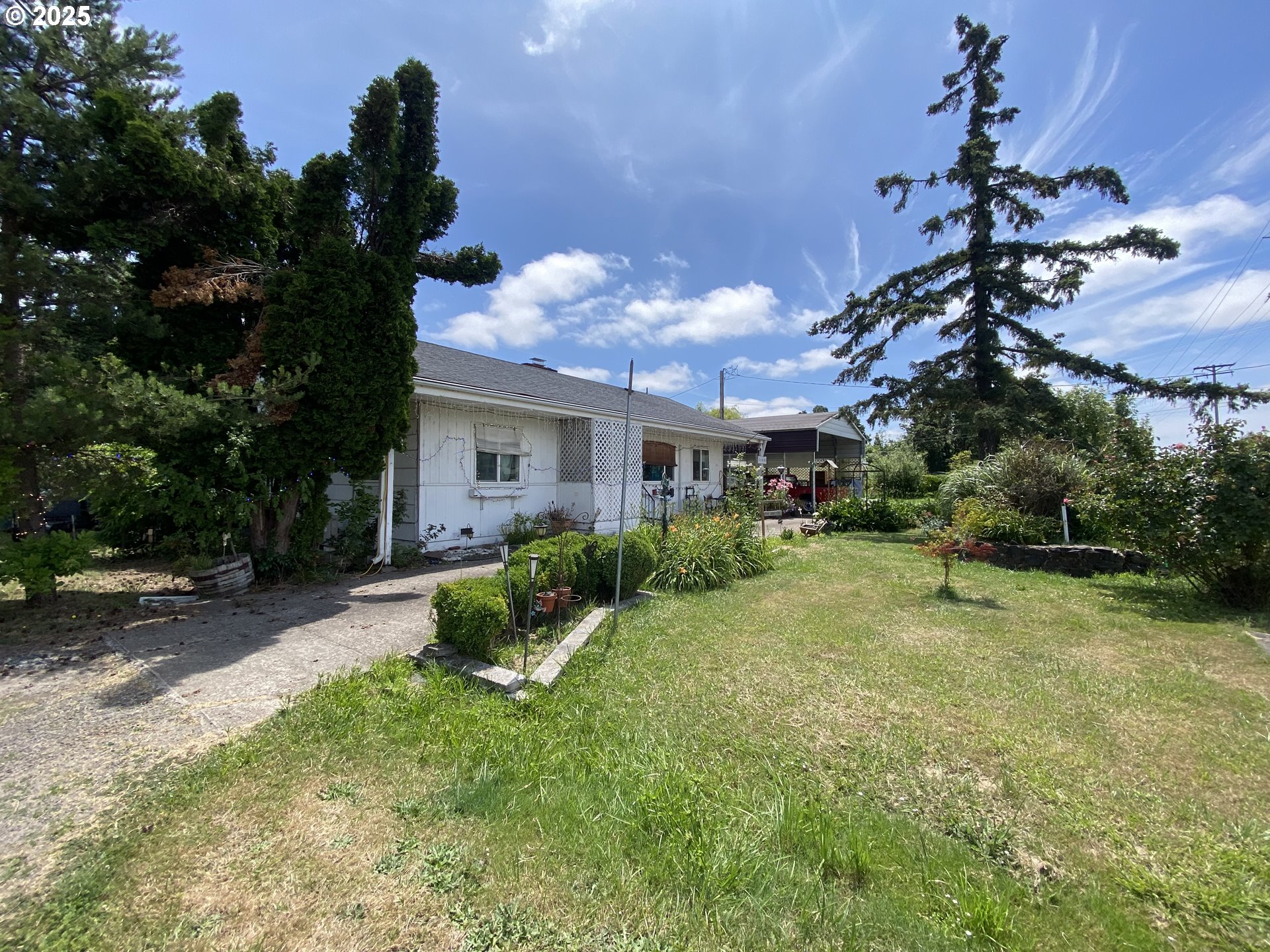 35001 Seavey Loop Road Eugene, OR 97405 - Photo 12 of 16 a view of a house with backyard and sitting area
