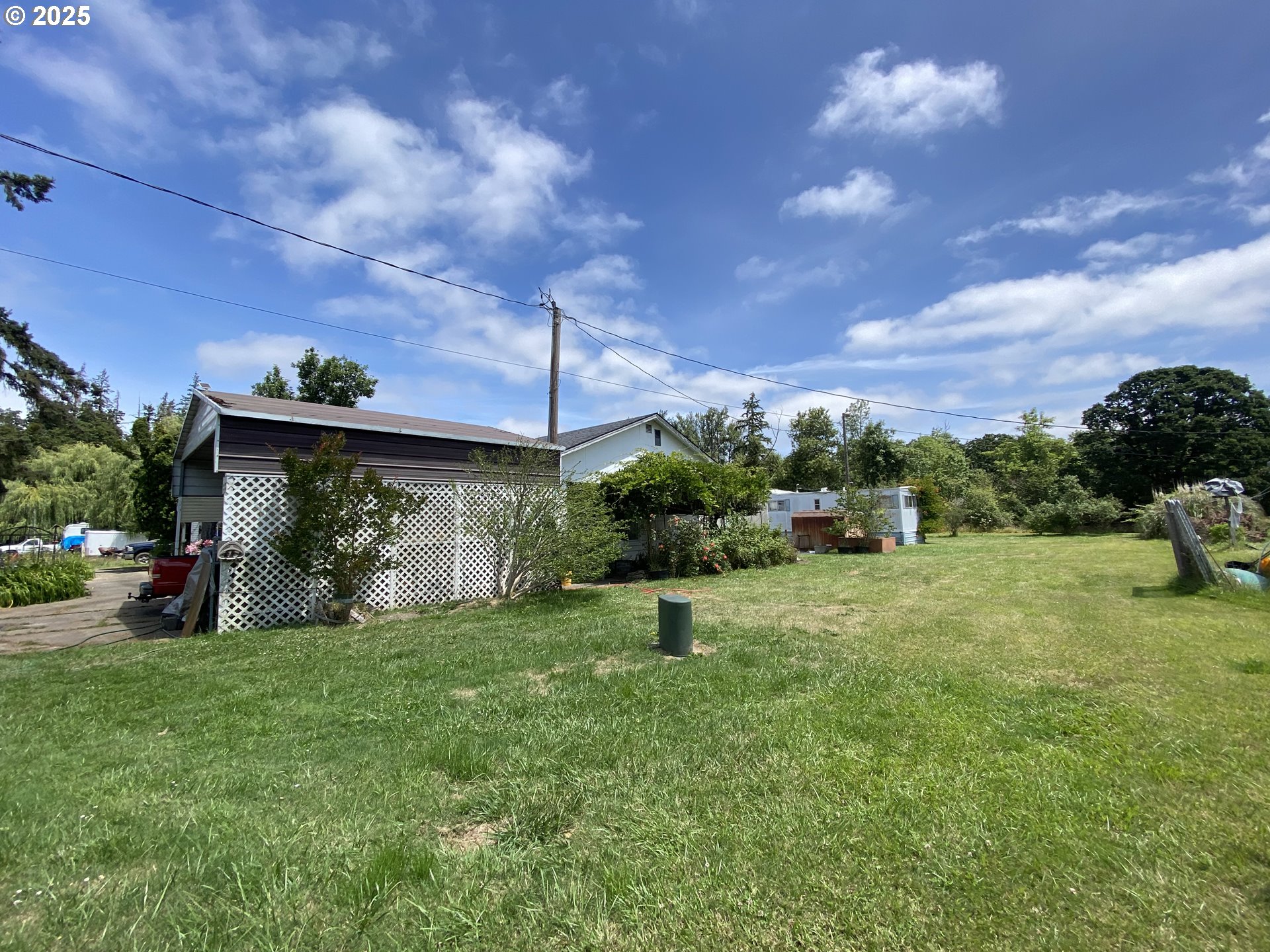 35001 Seavey Loop Road Eugene, OR 97405 - Photo 14 of 16 a view of a big yard with an tree and a fence