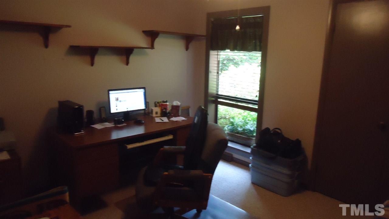 5409 Old Forge Circle Raleigh, NC 27609 - Photo 16 of 19 a view of a workspace with furniture and a window