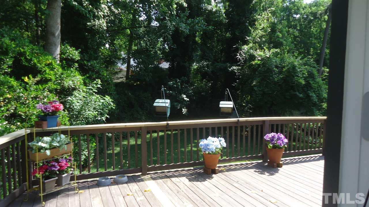 5409 Old Forge Circle Raleigh, NC 27609 - Photo 3 of 19 a view of a deck with wooden floor and fence
