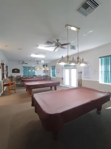 a large room with kitchen view