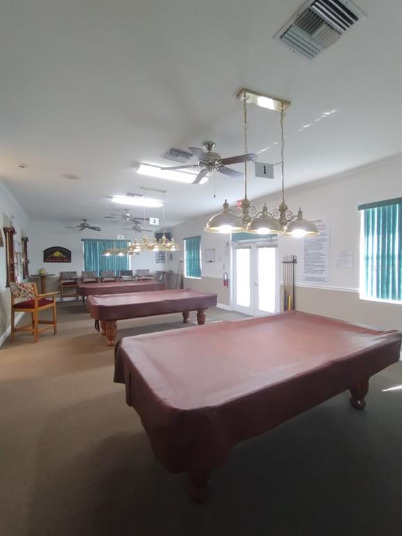 9833 Southwest 61st Court Ocala, FL 34476 - Photo 13 of 14 a kitchen with a table chairs and a fireplace