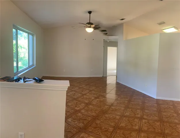 a kitchen with kitchen island a stove a sink dishwasher and a refrigerator