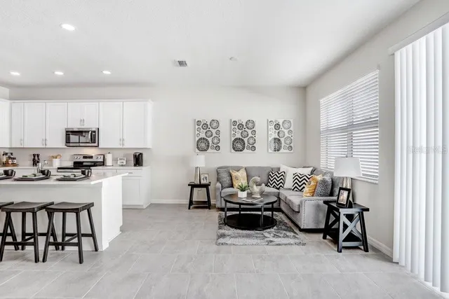 a living room with furniture and a table