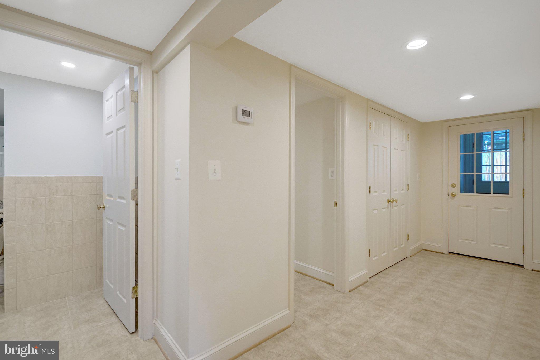 4409 Ferry Landing Road Alexandria, VA 22309 - Photo 51 of 68 Lower level hallway w/ door to exterior
