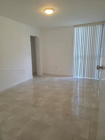 an empty room with a bench