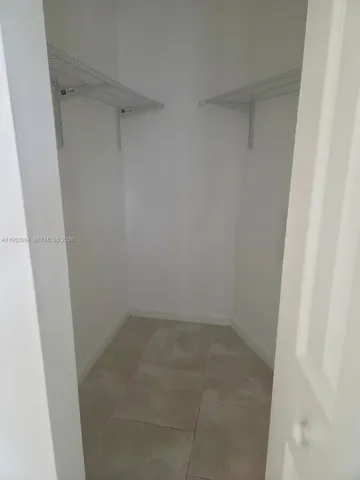 a view of swimming pool with outdoor seating and plants