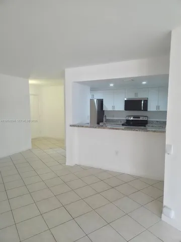 a view of a livingroom with an entryway