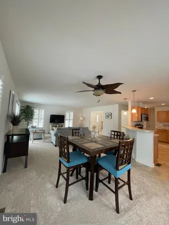 a kitchen with kitchen island a stove a counter top space and appliances