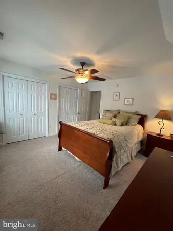a bed room with a bed and a window