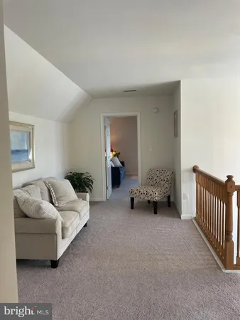 a view of a livingroom with furniture and a fireplace