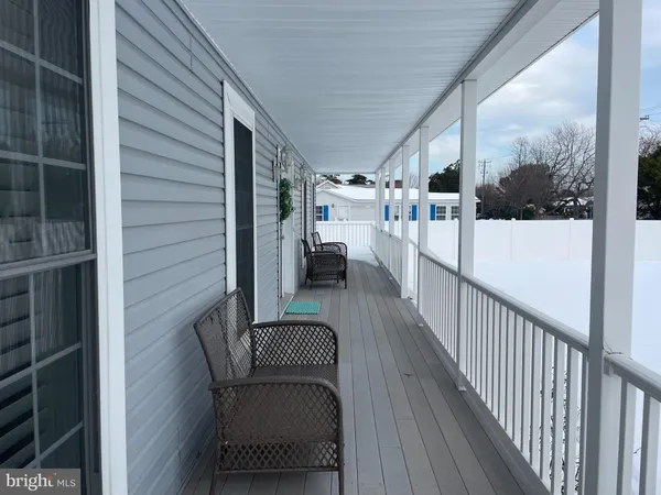 a view of a balcony with furniture