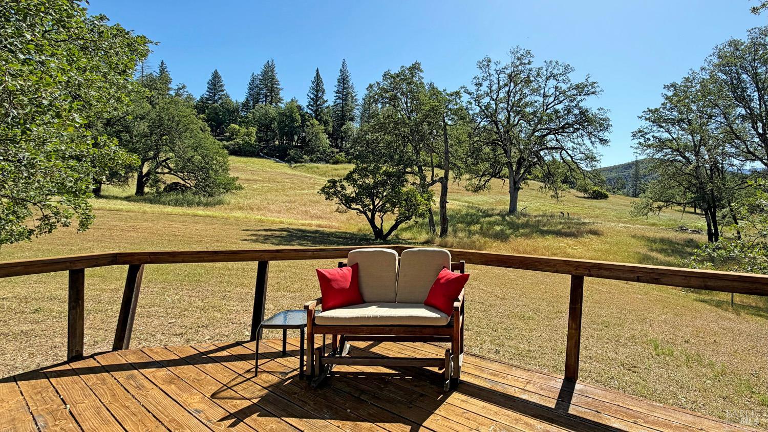 31312 High Point Road Potter Valley, CA 95469 - Photo 37 of 58 a view of a balcony with chairs and wooden fence