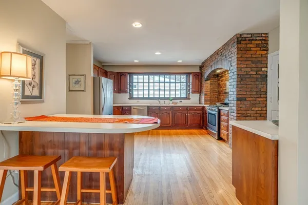 a kitchen with stainless steel appliances granite countertop a stove and a sink