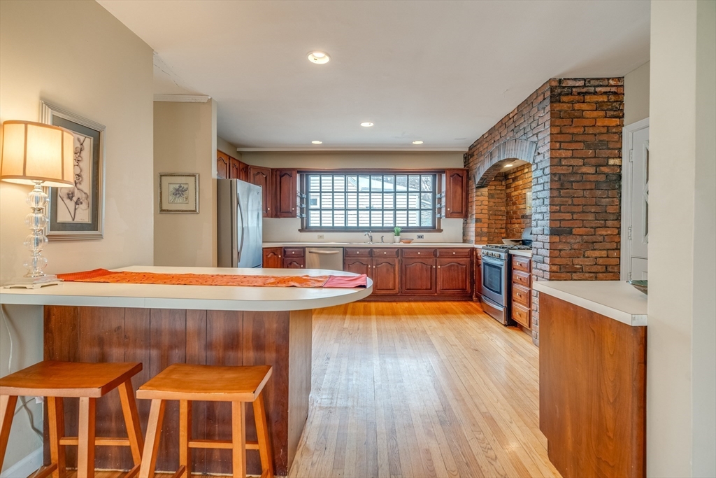13 Finn Street Northampton, MA 01060 - Photo 11 of 40 a room with a table chairs and a large window