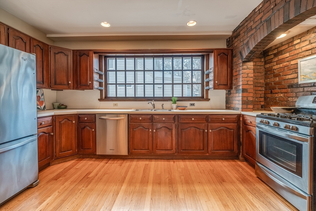 13 Finn Street Northampton, MA 01060 - Photo 13 of 40 a kitchen with stainless steel appliances granite countertop a stove a sink dishwasher and a refrigerator