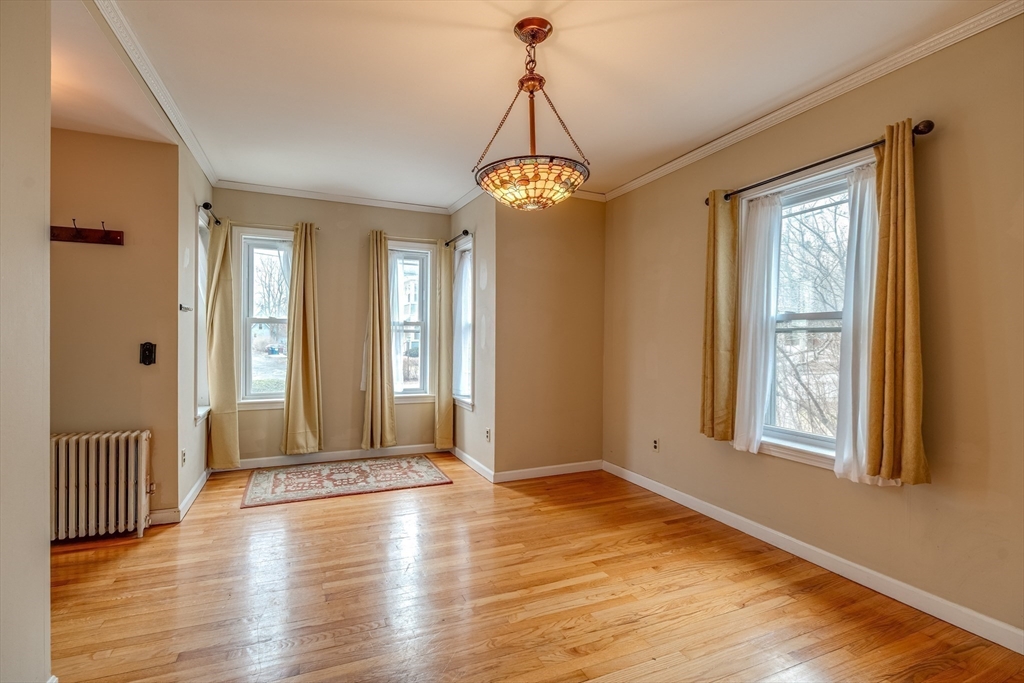 13 Finn Street Northampton, MA 01060 - Photo 21 of 40 a view of an empty room with wooden floor and a window