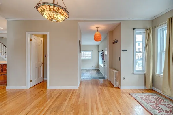 a view of a room that has a window and bed