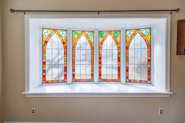 a bathroom with a toilet a sink a mirror and vanity
