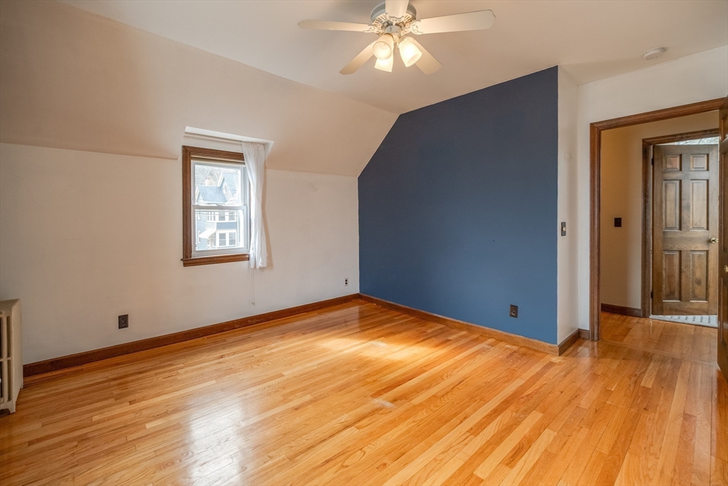13 Finn Street Northampton, MA 01060 - Photo 33 of 40 a view of an empty room with wooden floor and a window