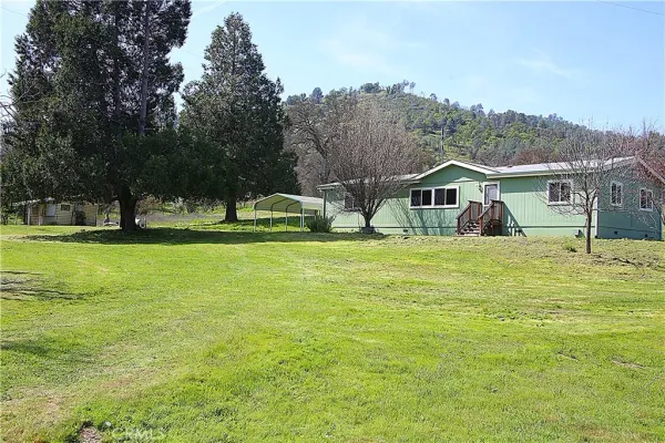 a view of a house with a big yard