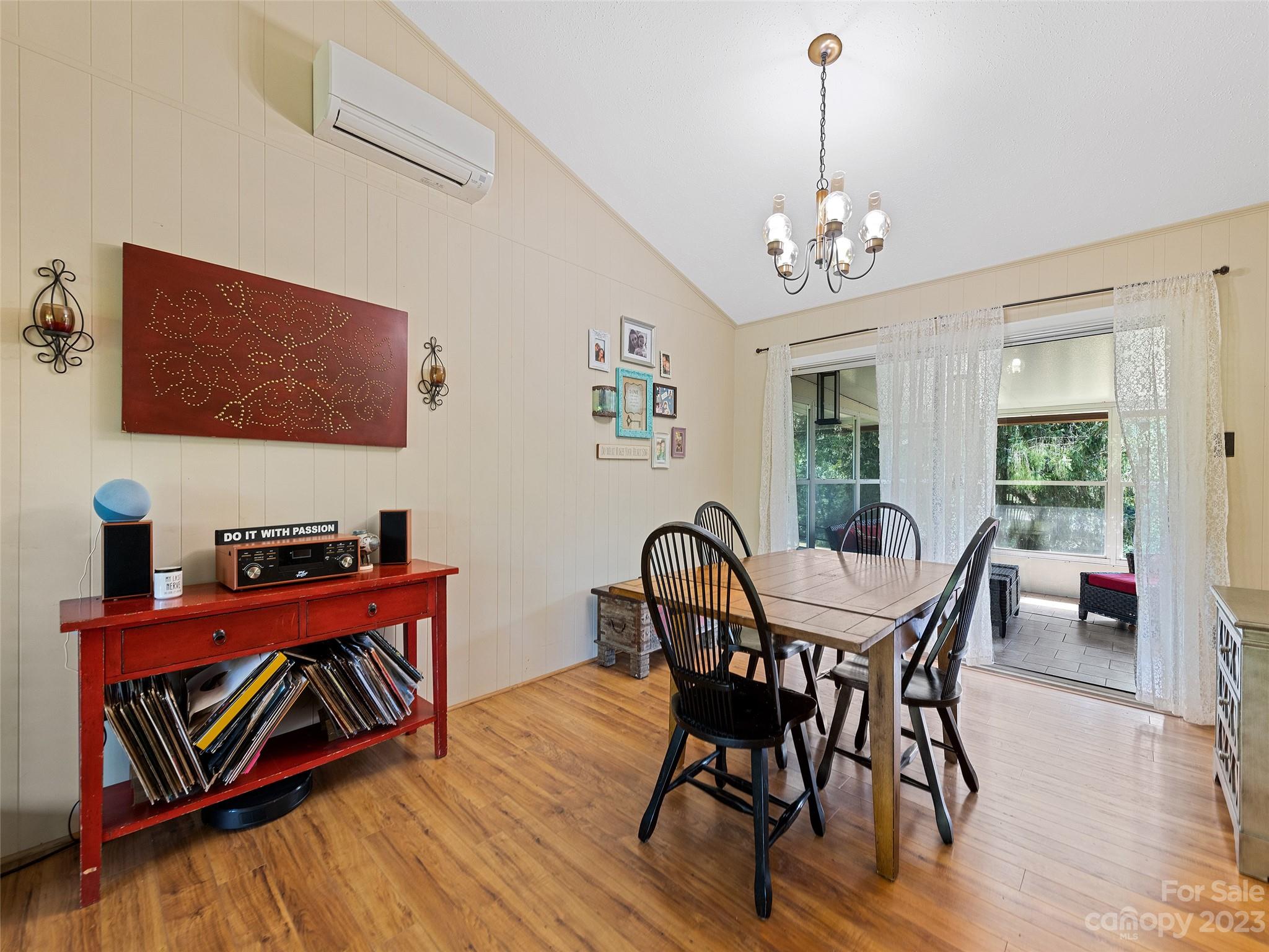 69 Patton Cemetery Road Swannanoa, NC 28778 - Photo 12 of 35 a view of a dining room with furniture window and wooden floor