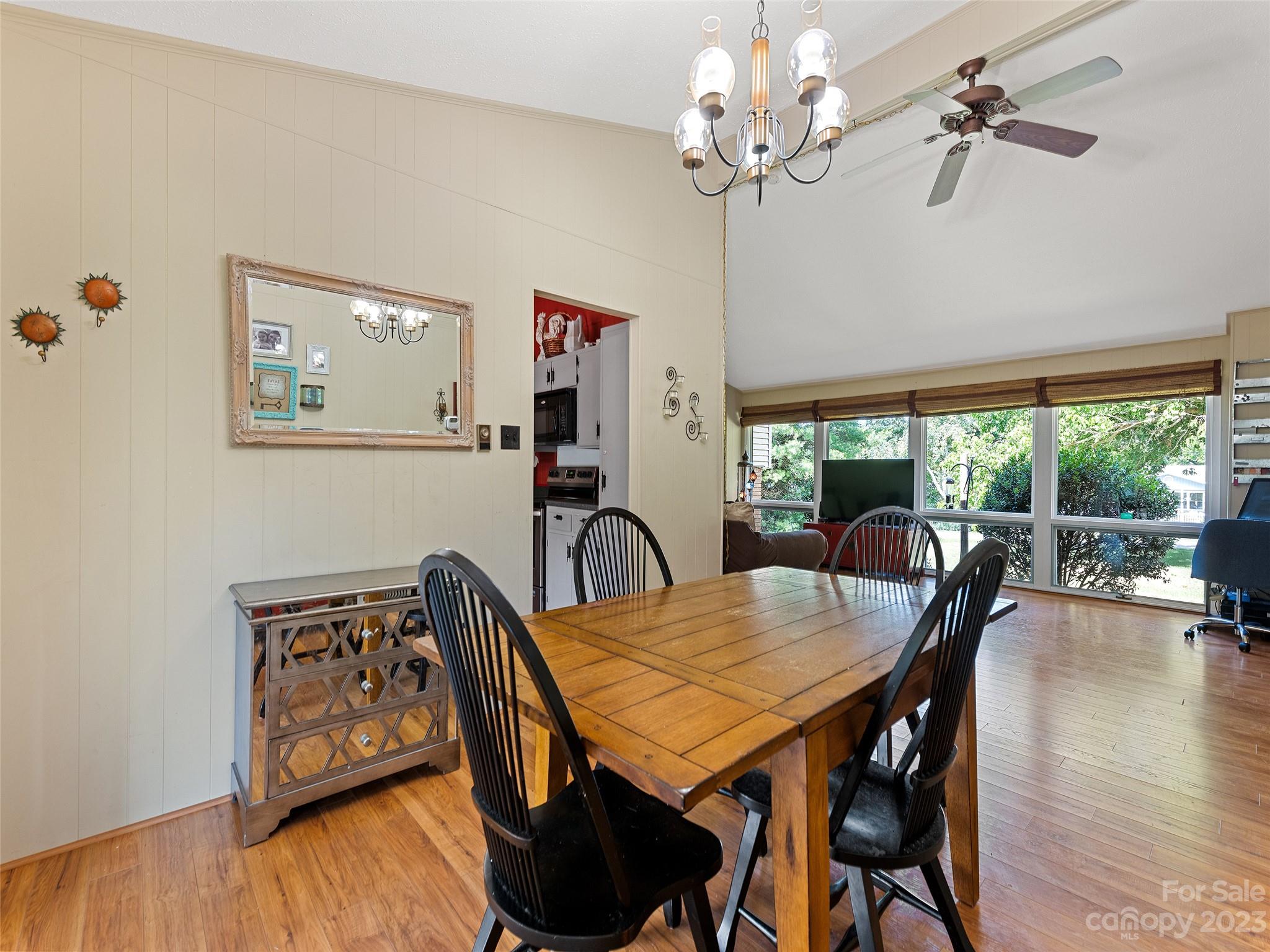 69 Patton Cemetery Road Swannanoa, NC 28778 - Photo 13 of 35 a view of a dining room with furniture window and wooden floor