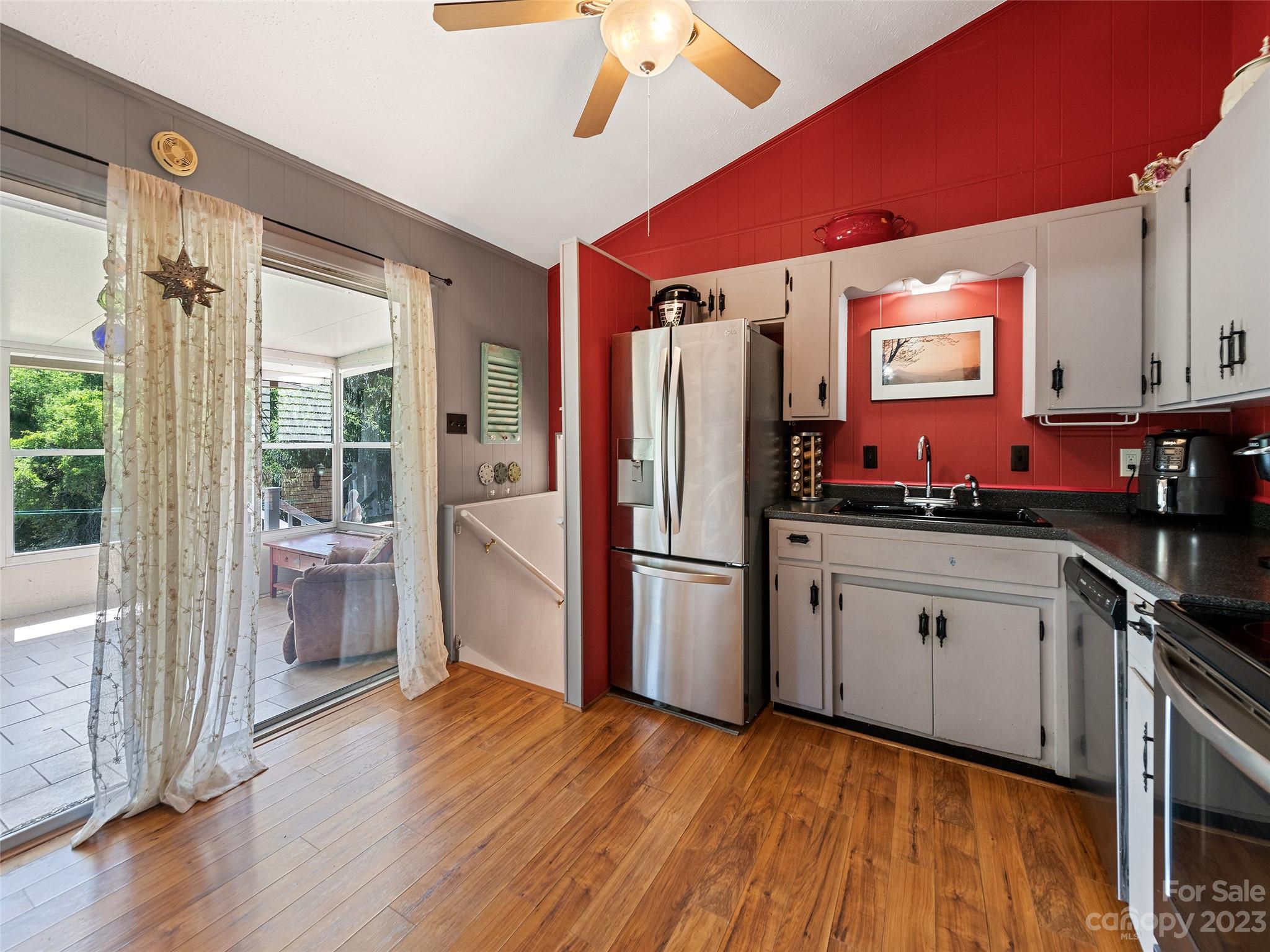 69 Patton Cemetery Road Swannanoa, NC 28778 - Photo 14 of 35 a kitchen with a refrigerator and a sink