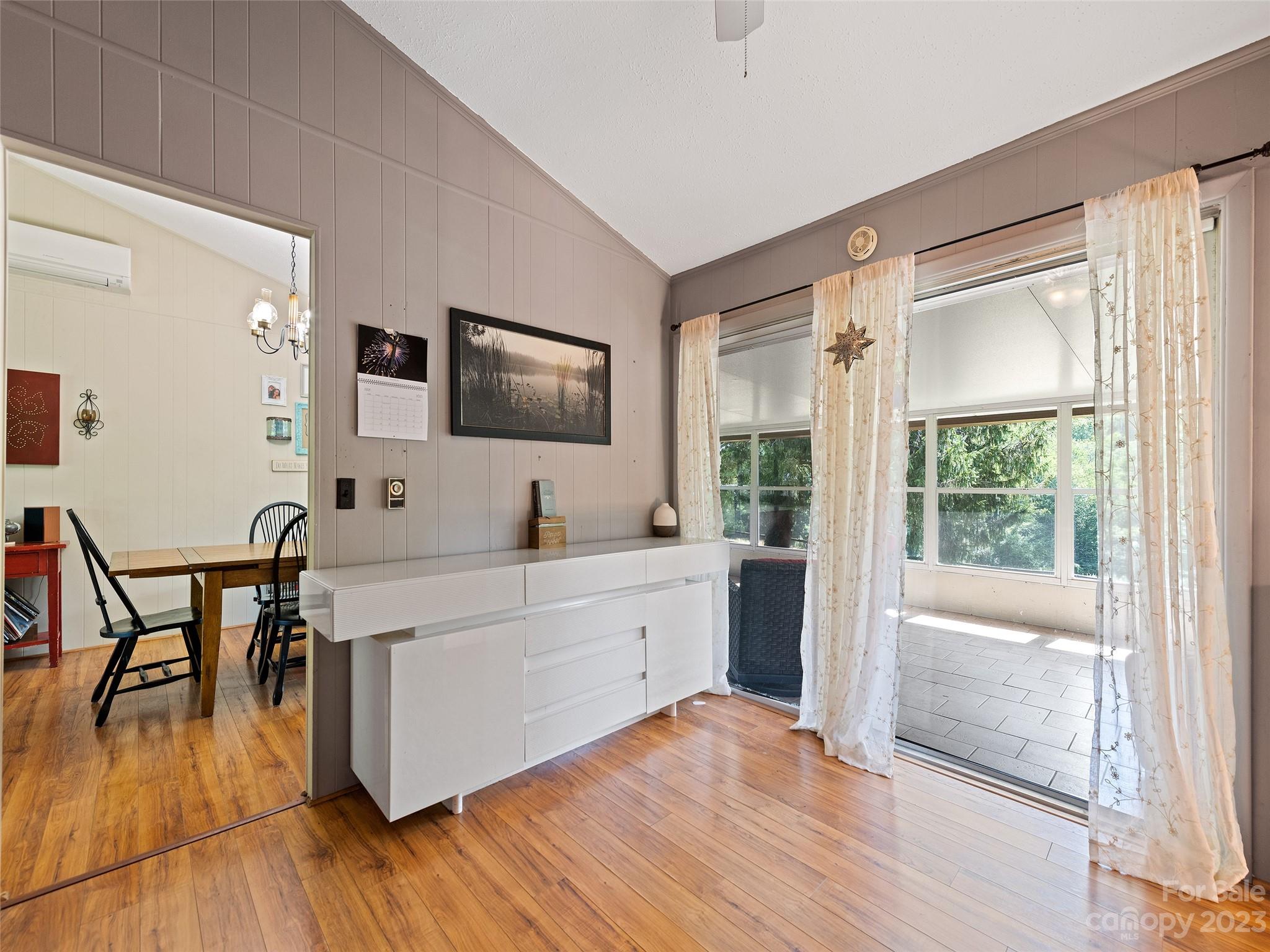 69 Patton Cemetery Road Swannanoa, NC 28778 - Photo 17 of 35 a large white kitchen with wooden floor and a sink