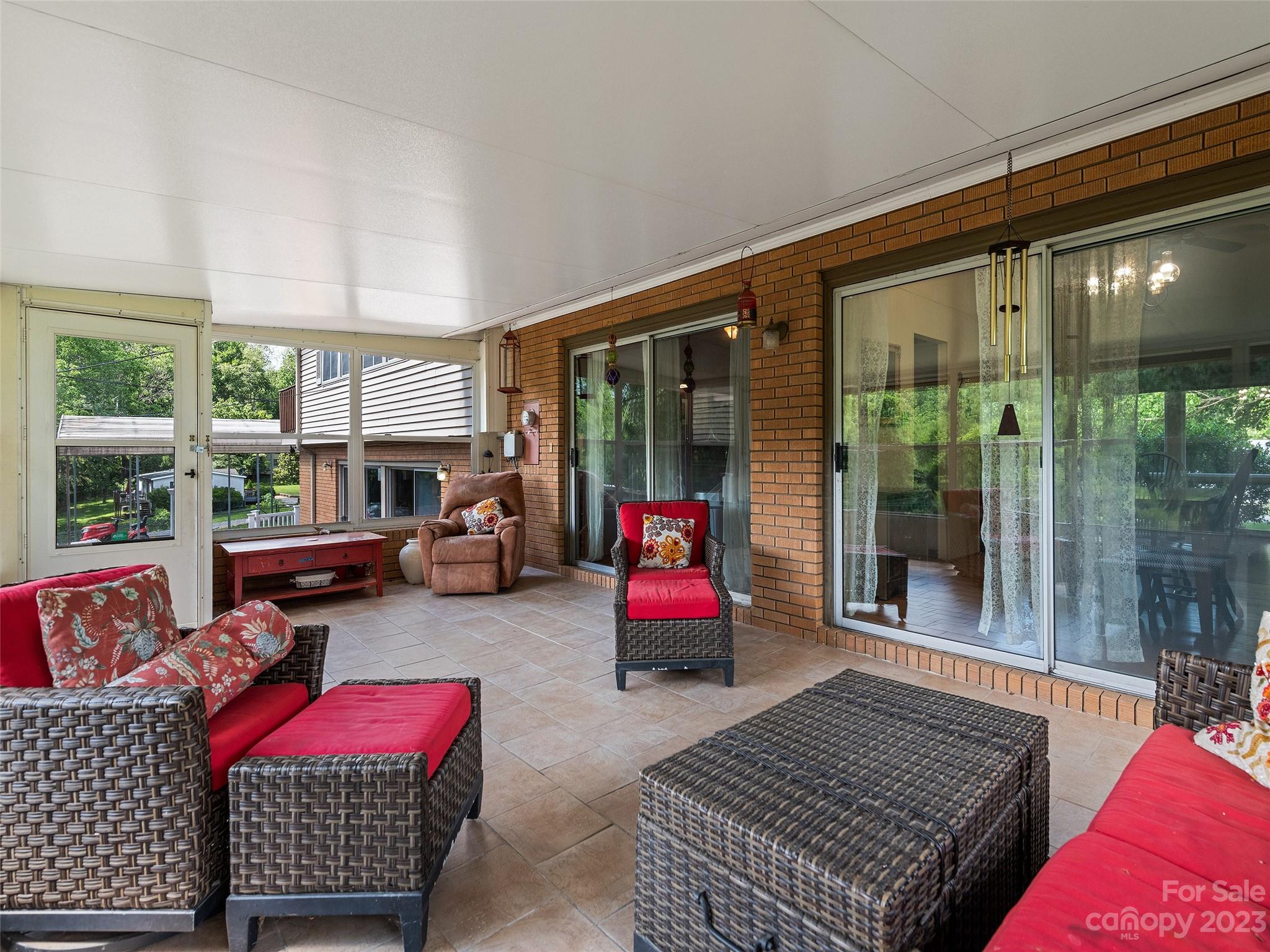 69 Patton Cemetery Road Swannanoa, NC 28778 - Photo 19 of 35 a bedroom with furniture and a large window
